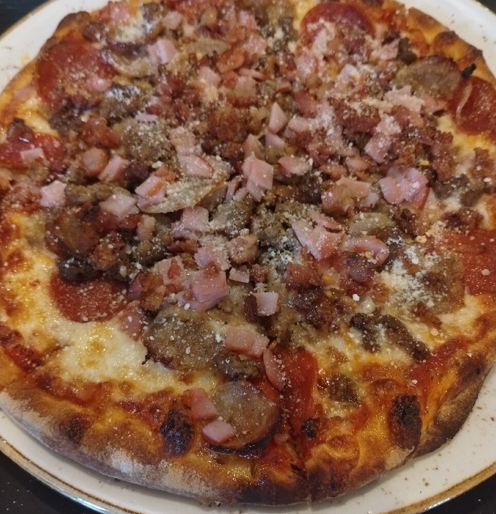 Benito’s Brick Oven Pizza and Pasta signature dishes The Godfather PizzaVeal ParmigianaManicotti